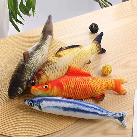 Four fish cat toys which are stuffed toys that look like real fish.