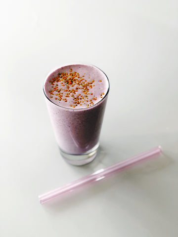 Image of a protein and berry post-workout smoothie topped with bee pollen