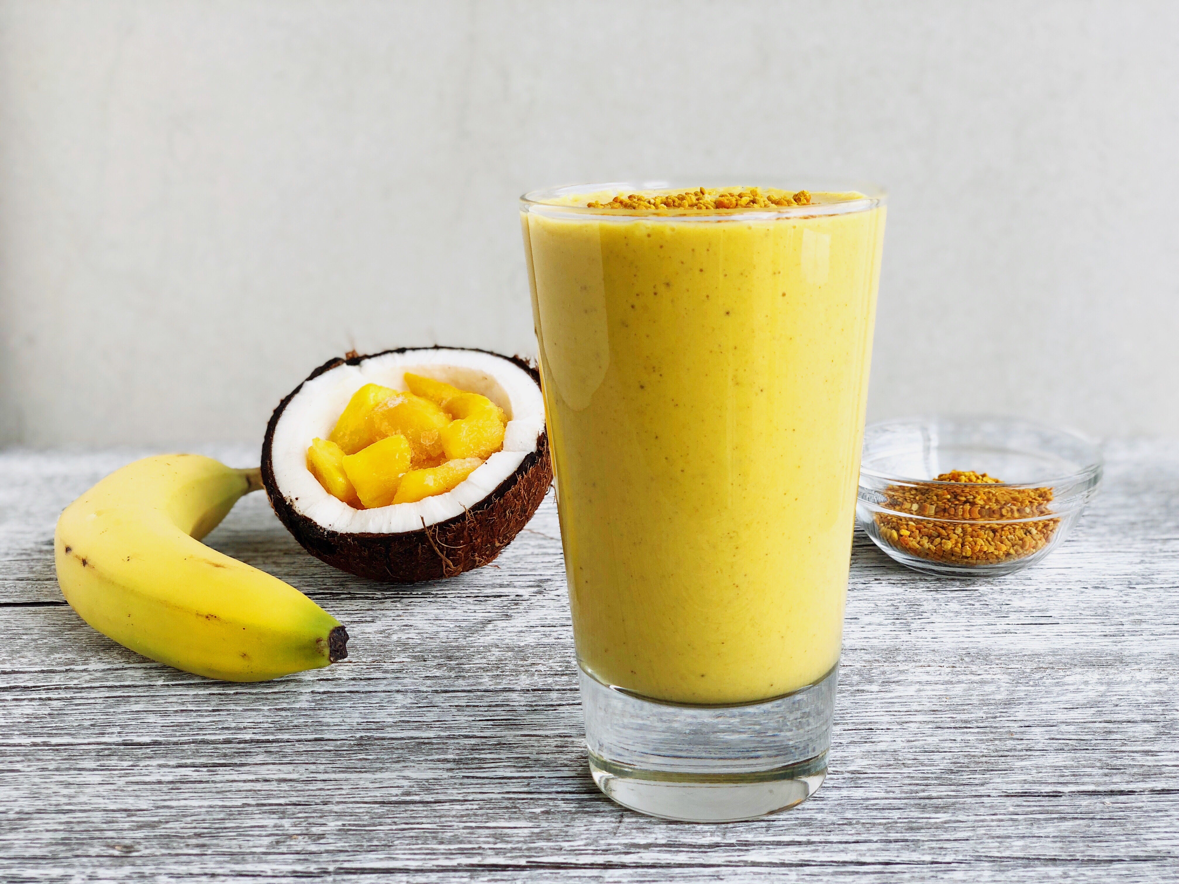 Tropical Turmeric Golden Milk Smoothie with banana, coconut, mango, bee pollen and JOYÀ Restore Turmeric Superblend