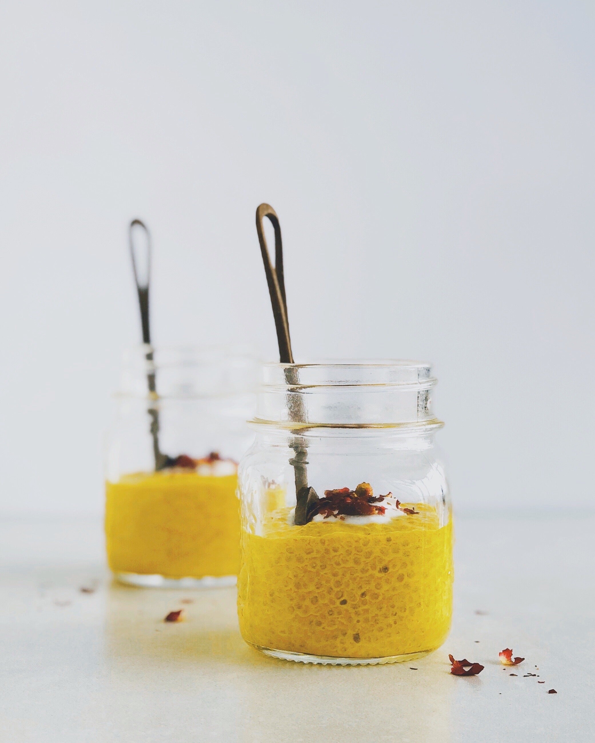 Two small jars with Turmeric chia pudding