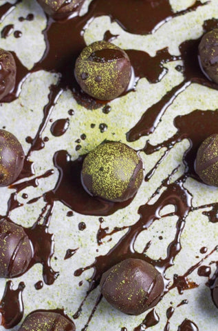 Raw chocolate macadamia matcha truffles.