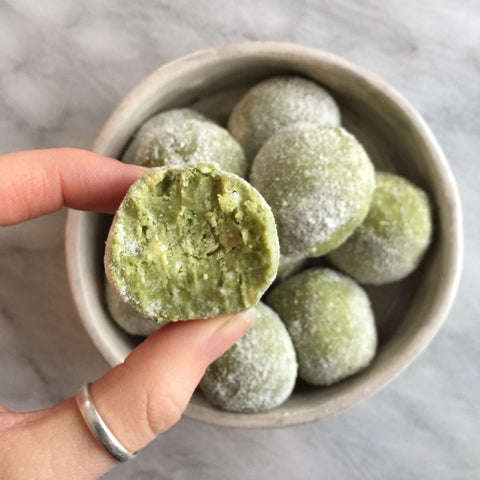 energy protein ball held by two fingers