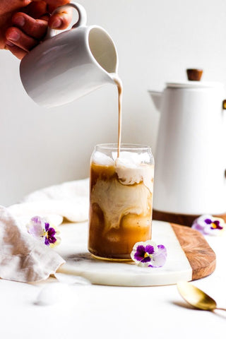 ombre gradiant pouring milk into coffee