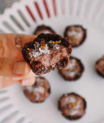 Raw Vegan Chocolate tart with coconut flakes, bee pollen and cacao nibs