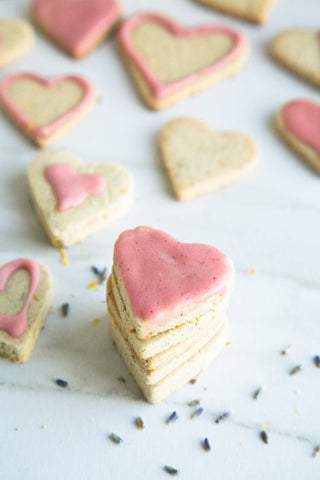 lavender cookies in heart shapes iced in different ways