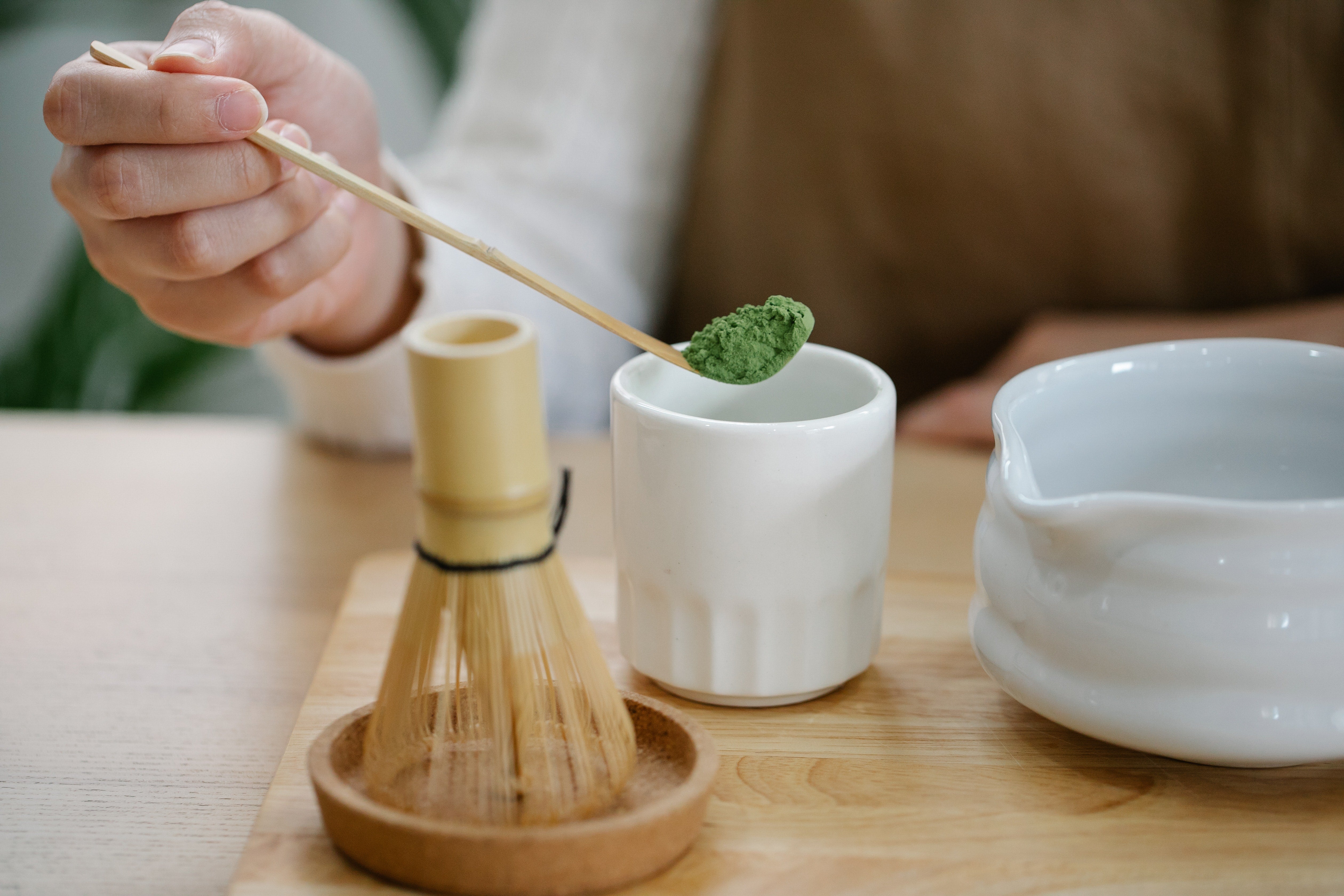 Traditional Matcha preparation with whisk and spoon