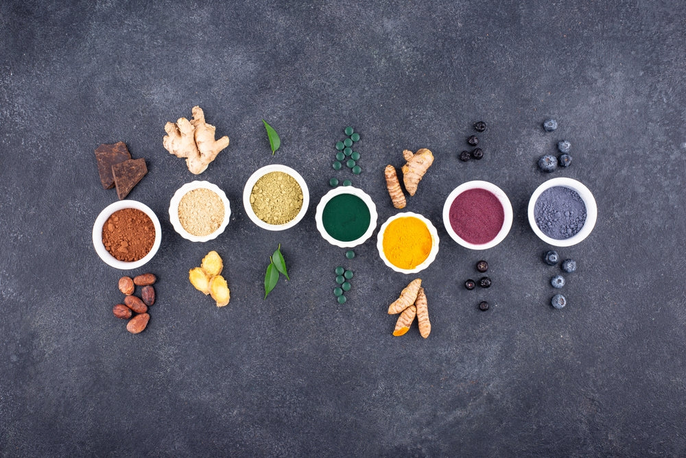 Overhead shot of bowls of superfoods and powders