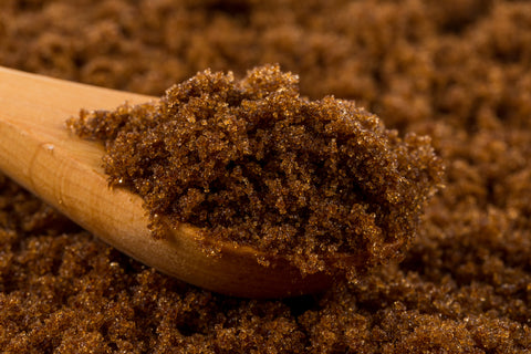 Close up image of a spoonful of brown sugar