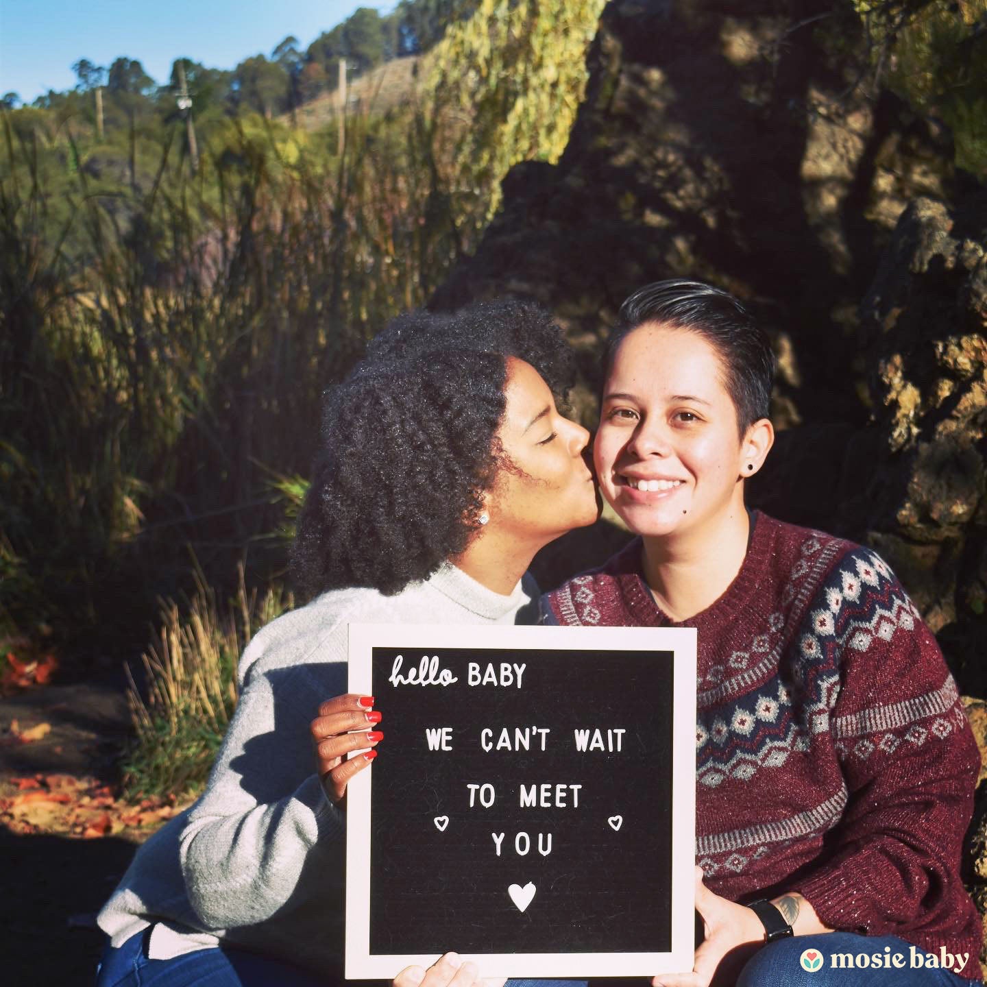 Two moms announcing their pregnancy with Mosie.