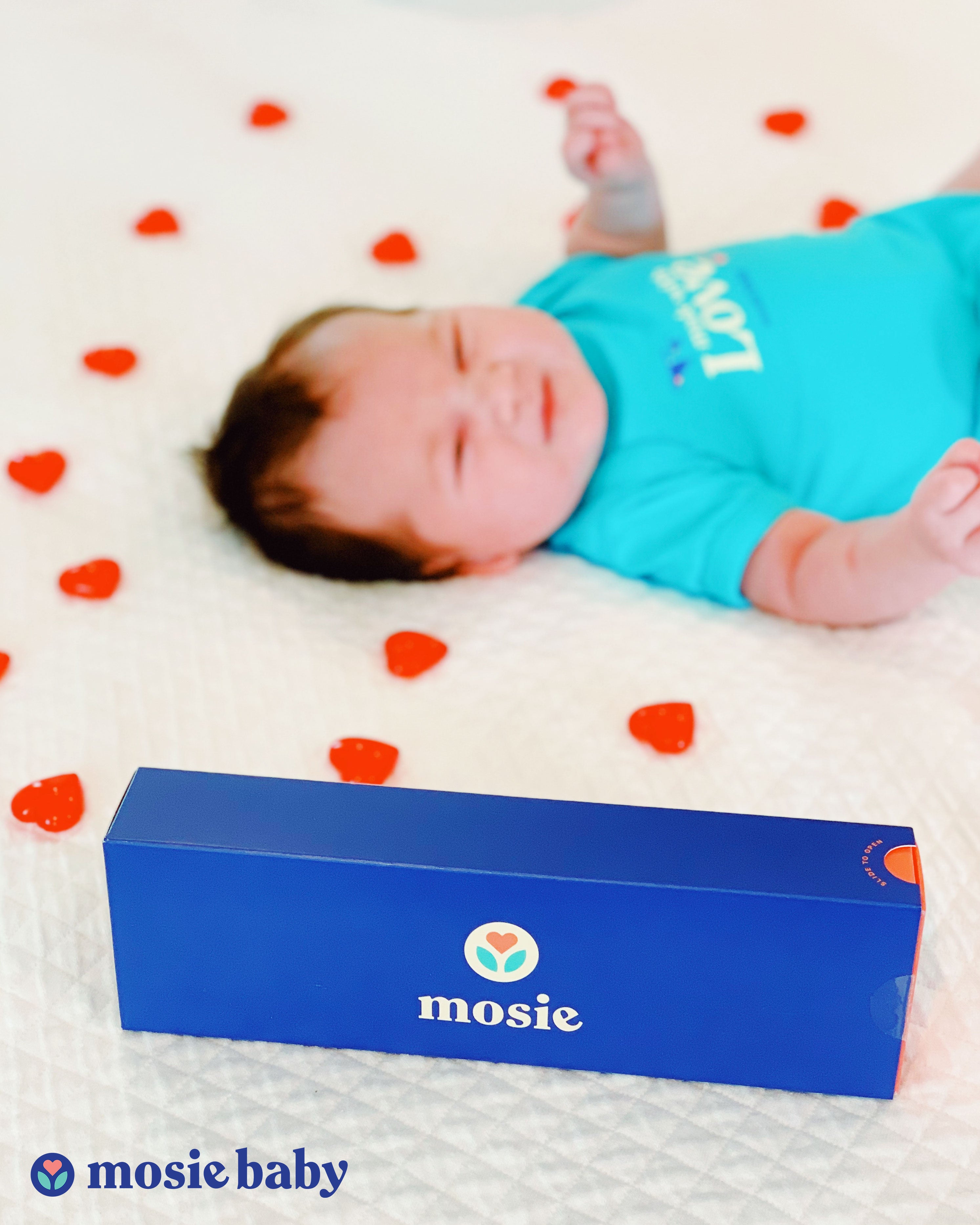 Mosie Baby in Mosie Onesie with the Mosie Kit