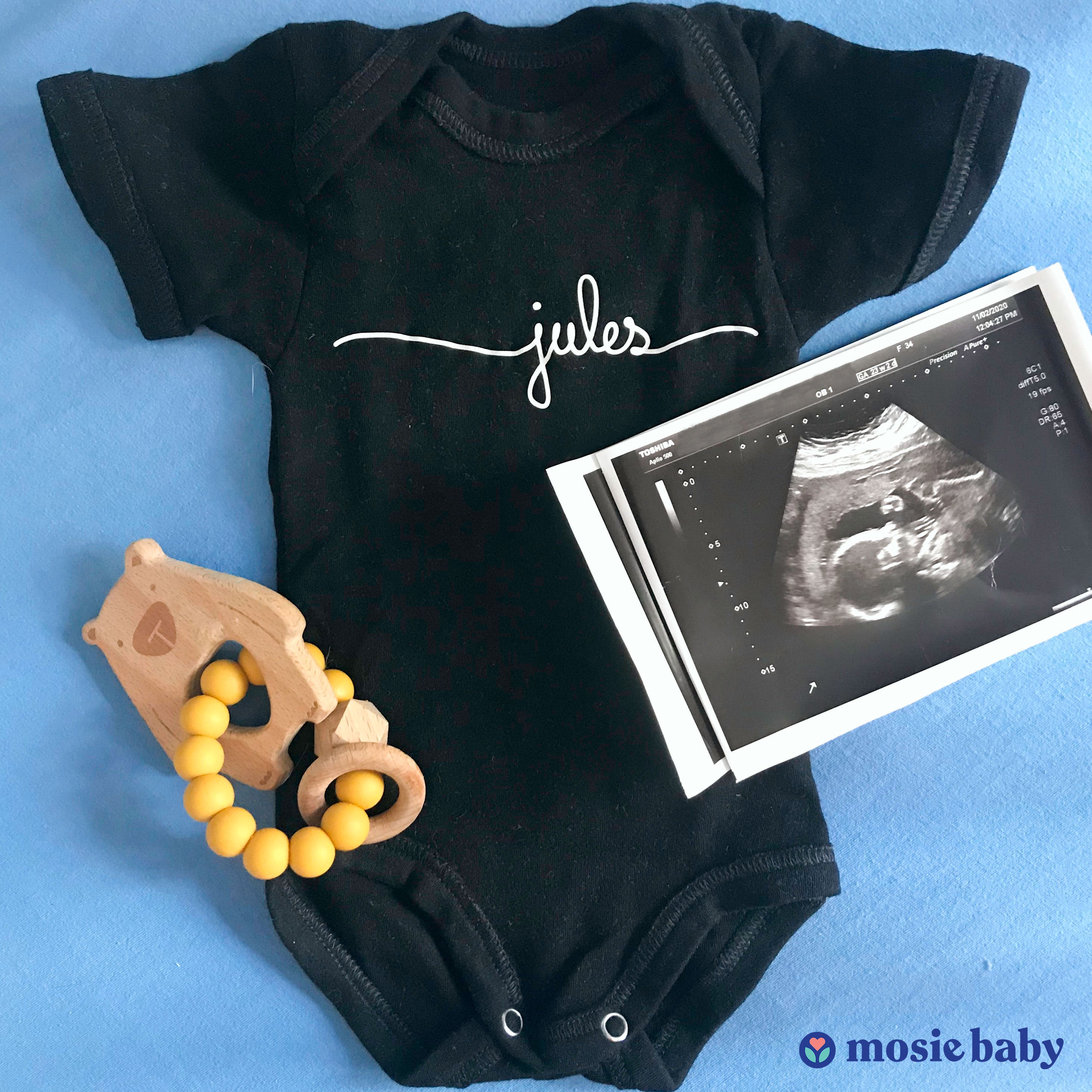 Mosie Baby Pregnancy Announcement with Onesie and Sonorgram