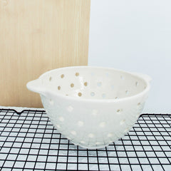 white ceramic berry colander