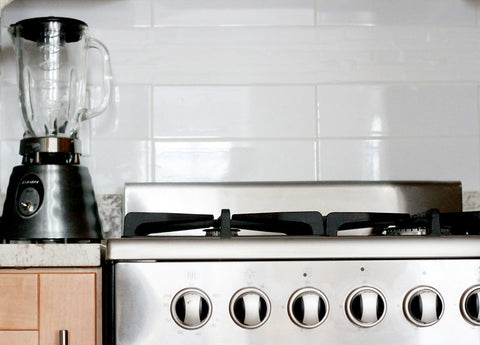 A cleanly polished stainless steel oven in a kitchen