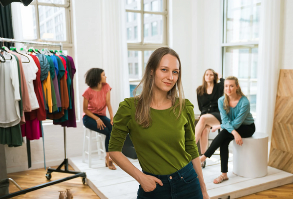 Women showing off their clothing pieces