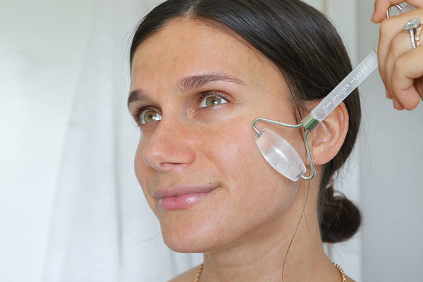 adi using the teami facial roller for lymphatic drainage