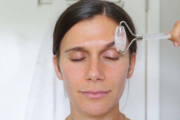 adi arezzini using the teami facial roller for headache relief