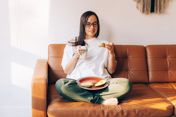 relaxing and eating avocado toast