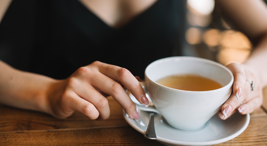 A Person Drinking Dragon Well Tea