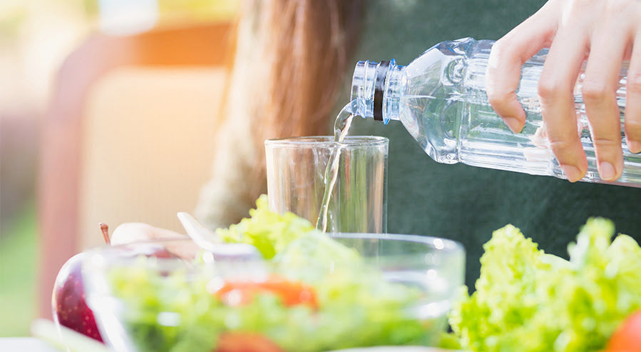 A Person Eating Healthy and Staying Hydrated