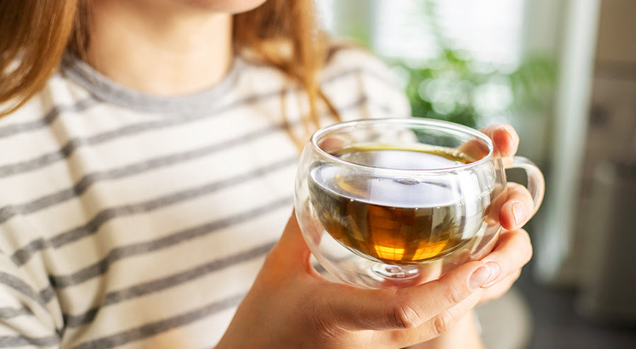 A Person Holding a Cup of Tea