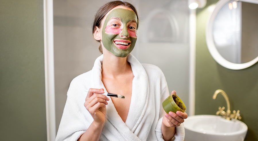 A Woman Applying a Spirulina Face Mask