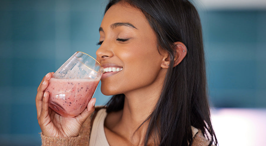 A Woman Drinking a Smoothie