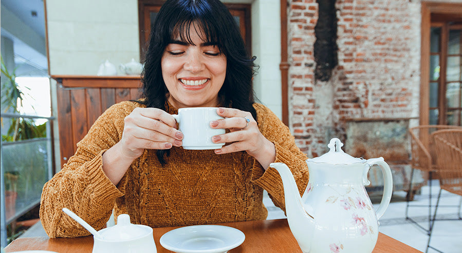 A Woman Drinking a Tea Blend