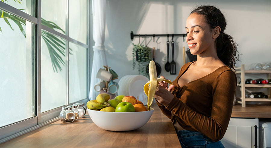 A Woman Eating a Banana