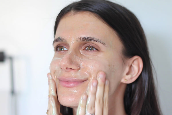 adi washing her face with Teami superfood face cleanser