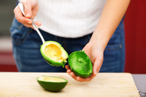 woman eating avocado 