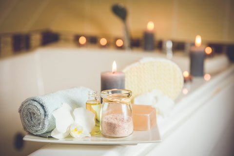 spa like atmosphere at home by the bath tub candles lit