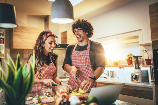 couple having fun while making a new recipe