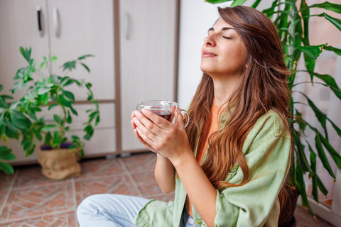 Woman relaxed while drinking Green Tea