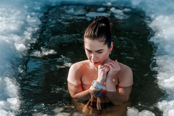 woman taking an outdoor ice bath