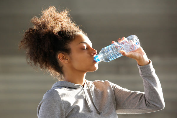 young woman drinking water