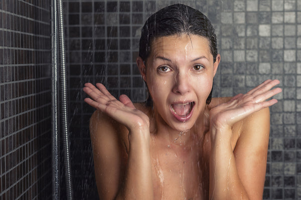 woman taking a cold shower