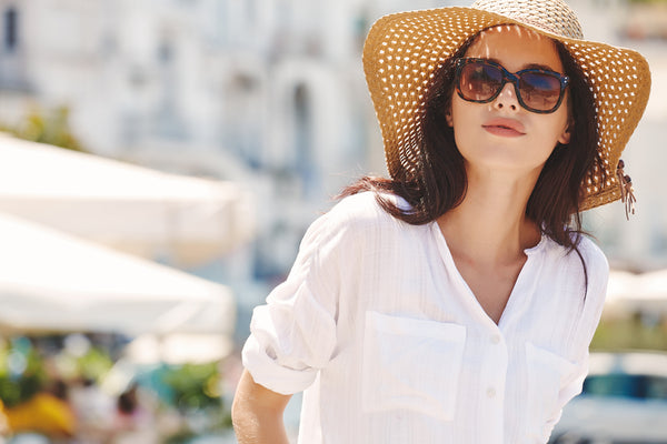 woman wearing a hat for sun protection