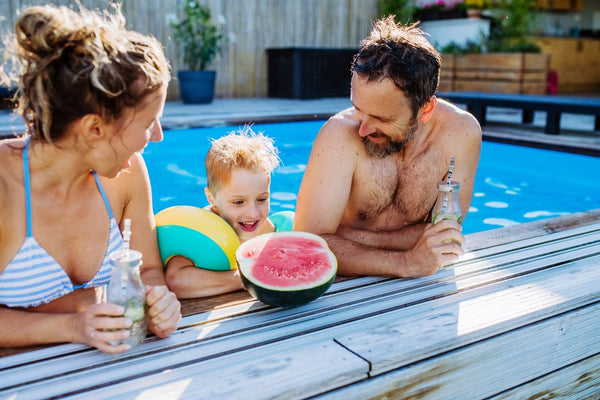 drinking water and eating fruit in the pool