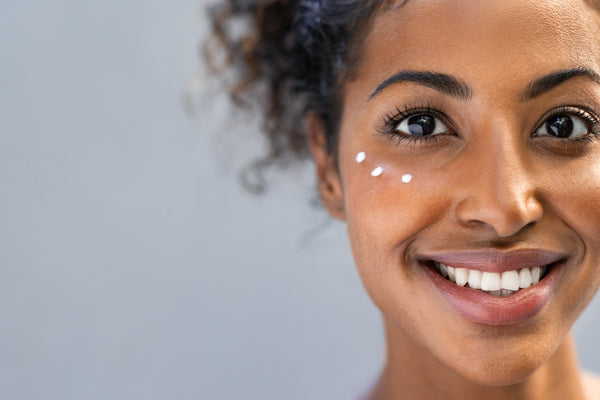 woman with three dots of renew eye cream below her eye