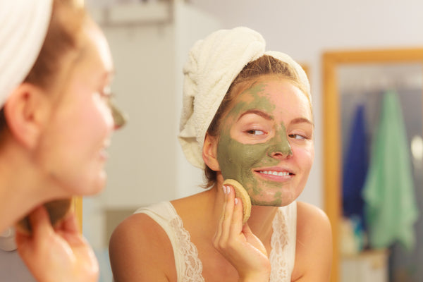 woman removing Teami Detox Clay Mask