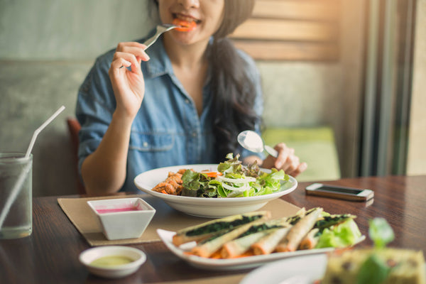 woman maintaining a healthy diet with salad