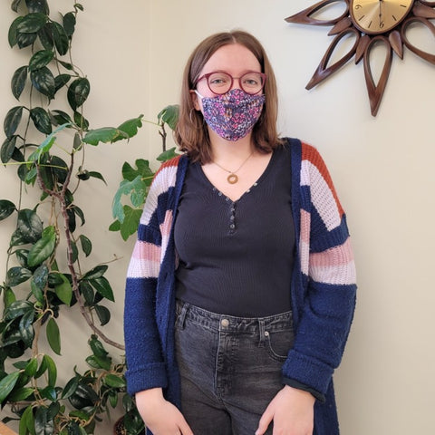 Intern Anna smiling in her Purple Floral Face Mask 