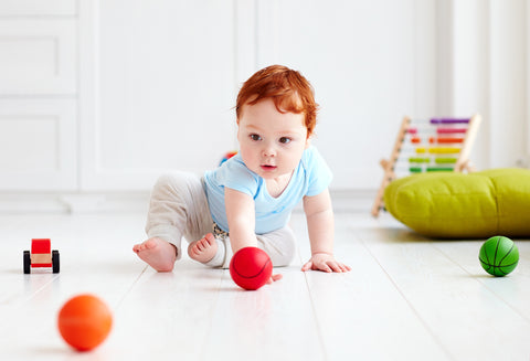 baby playing indoors - stay on socks