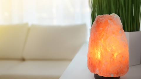 Salt lamp near sofa