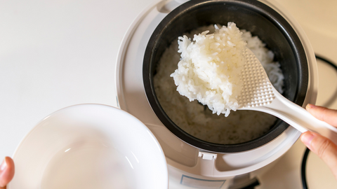 serving rice from a rice cooker