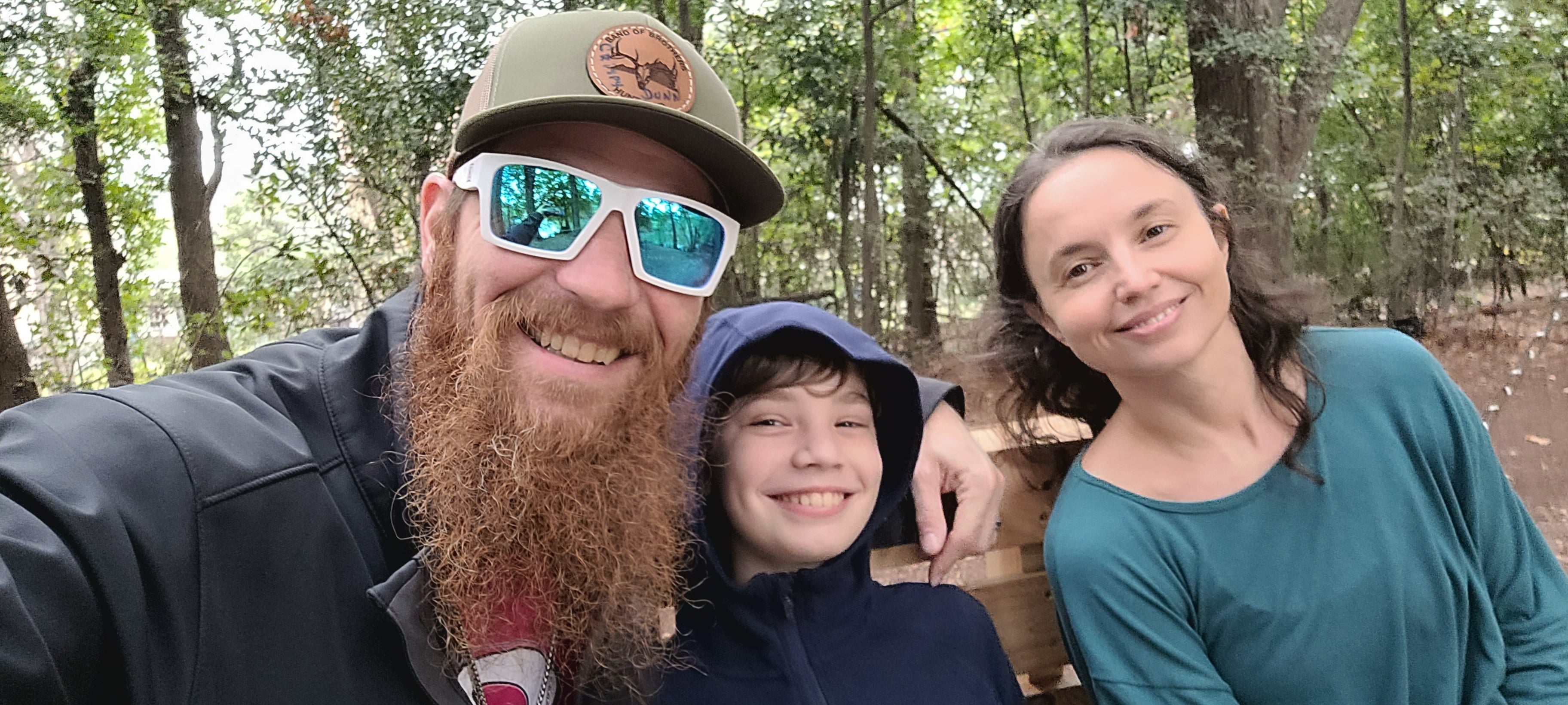 Sterling Dunn (left) with his son (center) and wife (right) 