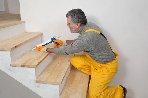 construction worker caulking