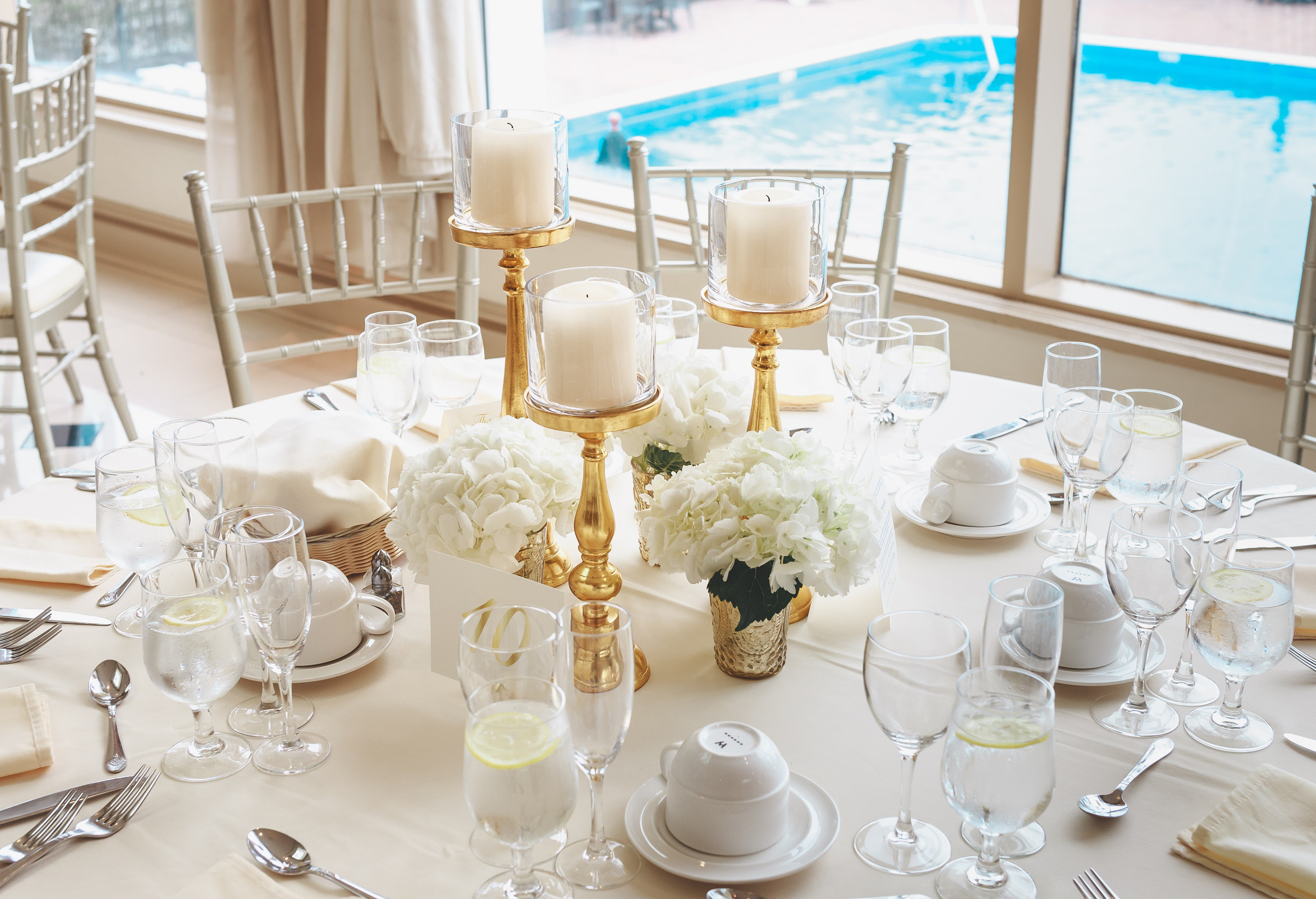 Gold candle chandeliers on table