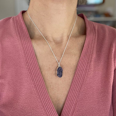 Pendant necklaces look best with a v-neck top