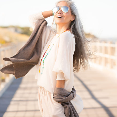 Woman wearing cashmere on dock in Martha's Vineyard